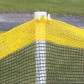 Roll-A-Fence Knitted Polyethylene Fence - Rolled Barrier & Outfield Fencing - Green - BF05-G (Green With Yellow Top Installation Example Shown)