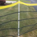 Roll-A-Fence Knitted Polyethylene Fence - Rolled Barrier & Outfield Fencing - Green - BF05-G (Green With Yellow Top Installation Example Shown)